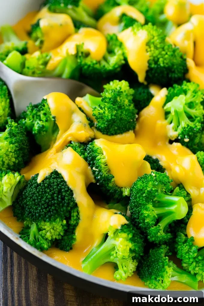 Brokoli Peynir Soslu Tarifi | Ev Yapımı Peynir Sosu | Brokoli Yancı #brokoli #peynir #düşükkarbonhidrat #yancı #dinneratthezoo A pan of steamed broccoli smothered in melted cheese sauce.