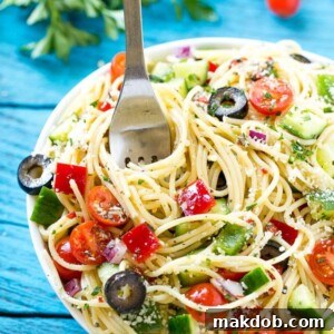This recipe for spaghetti salad is a unique pasta salad brimming with crunchy vegetables and rich parmesan cheese, all tossed together in a homemade zesty Italian dressing. It’s the perfect dish to feed a crowd when you’re entertaining!
