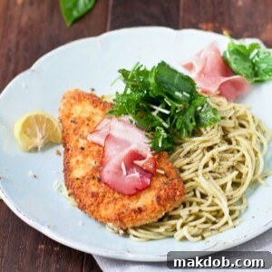 An image of chicken Bellagio on a bed of noodles.