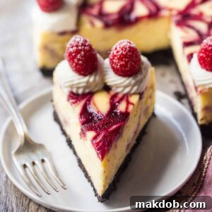 An image of a slice of white chocolate raspberry cheesecake.