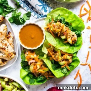 An image of three Thai lettuce wraps with a peanut sauce.