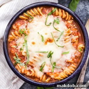 A comforting bowl of slow cooker chicken parmesan soup, a delightful fusion of Italian flavors.