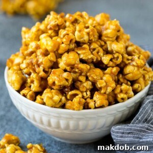 A serving bowl filled with caramel popcorn.