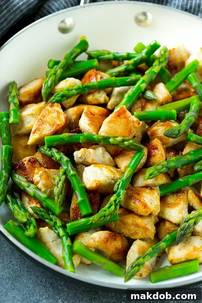 Speedy Chicken and Asparagus Stir Fry 3 A skillet of seared chicken and asparagus.