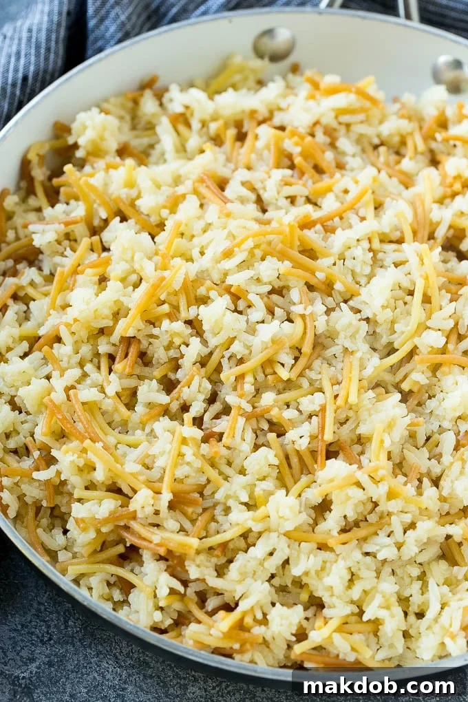 Cooked rice-a-roni in a skillet.