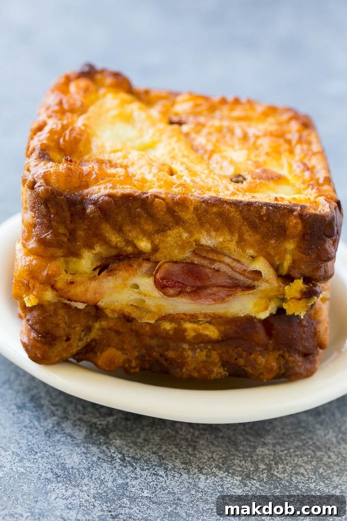 Disneyland Monte Cristo Sandwich 4 A Monte Cristo sandwich with layers of turkey, ham and cheese.