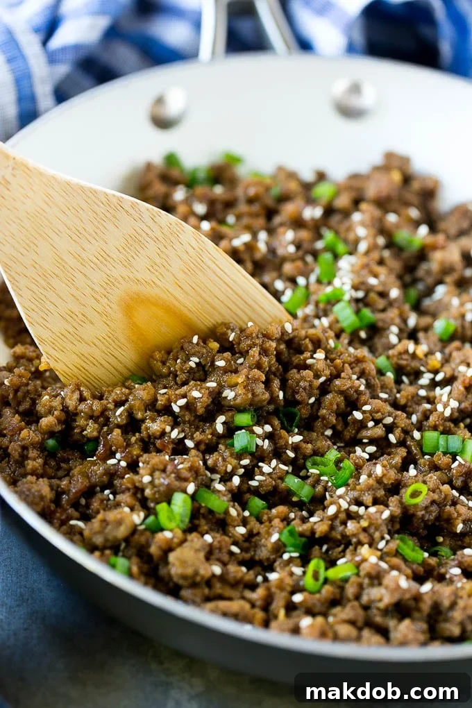 A pan of Korean beef with a spatula.