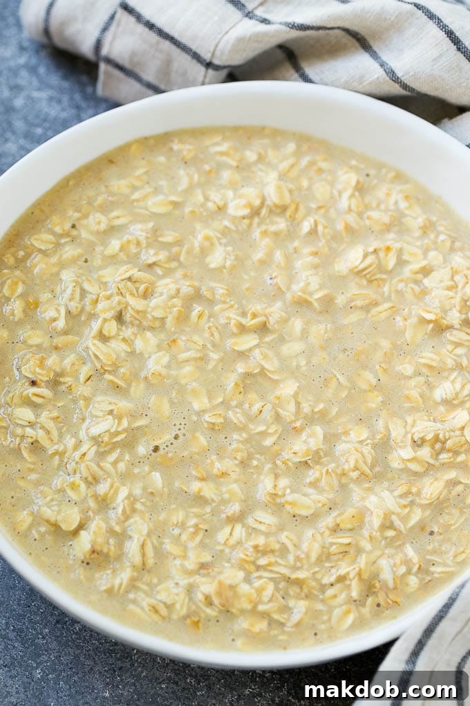 All of the ingredients for baked oatmeal cups mixed up in a bowl.