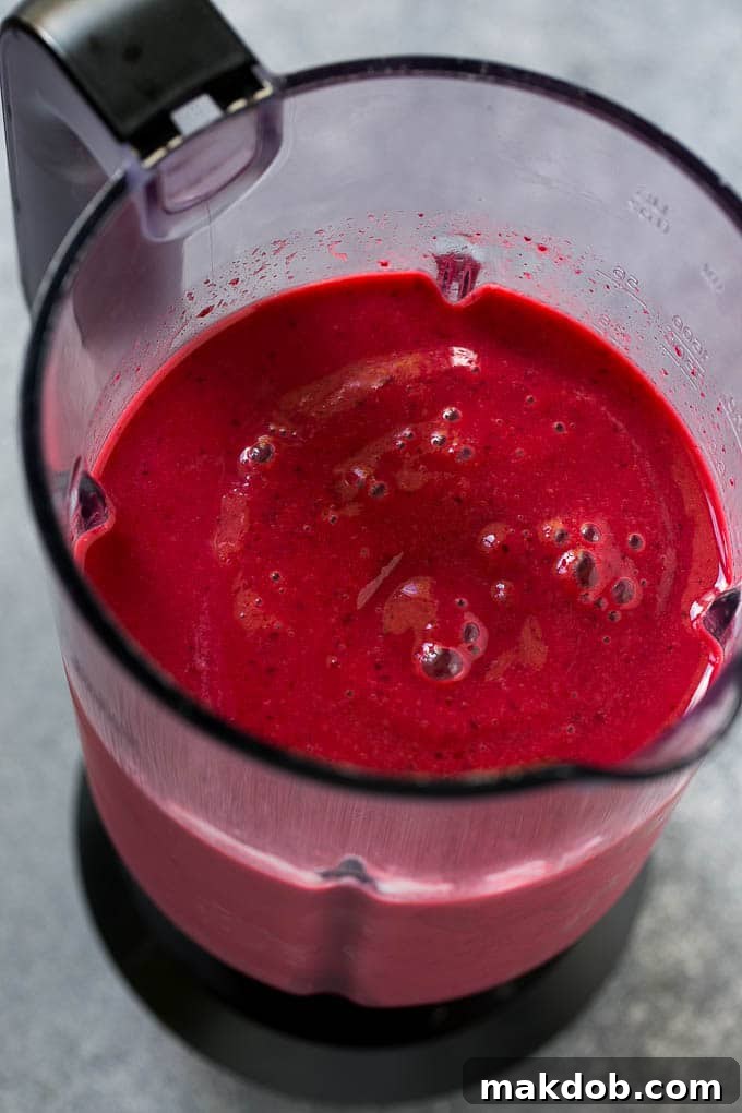Cherry Smoothie Recipe | Healthy Smoothie | Easy Smoothie A blender full of cherry smoothie.