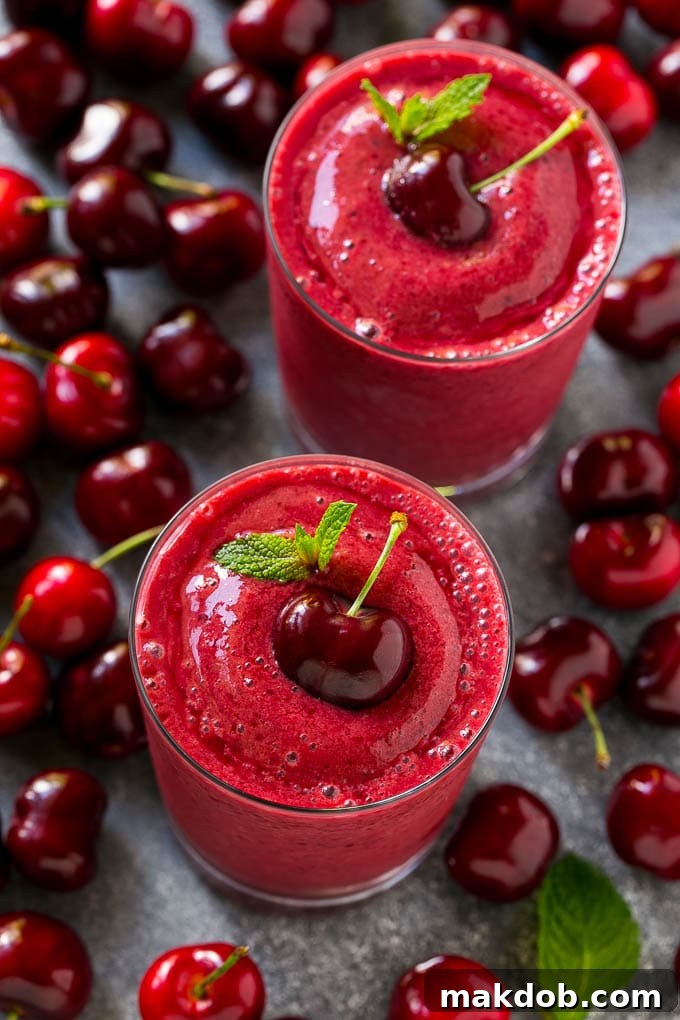 Cherry Smoothie Recipe | Healthy Smoothie | Easy Smoothie Cherry smoothie surrounded by fresh cherries.
