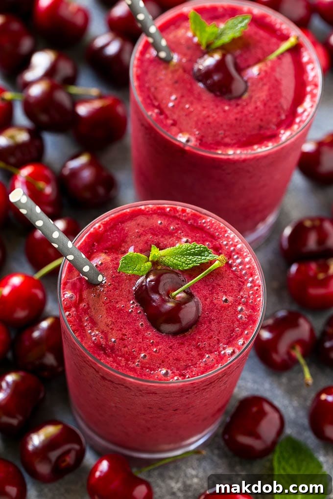 Cherry Smoothie Recipe | Healthy Smoothie | Easy Smoothie Two cherry smoothies topped with fresh cherries.