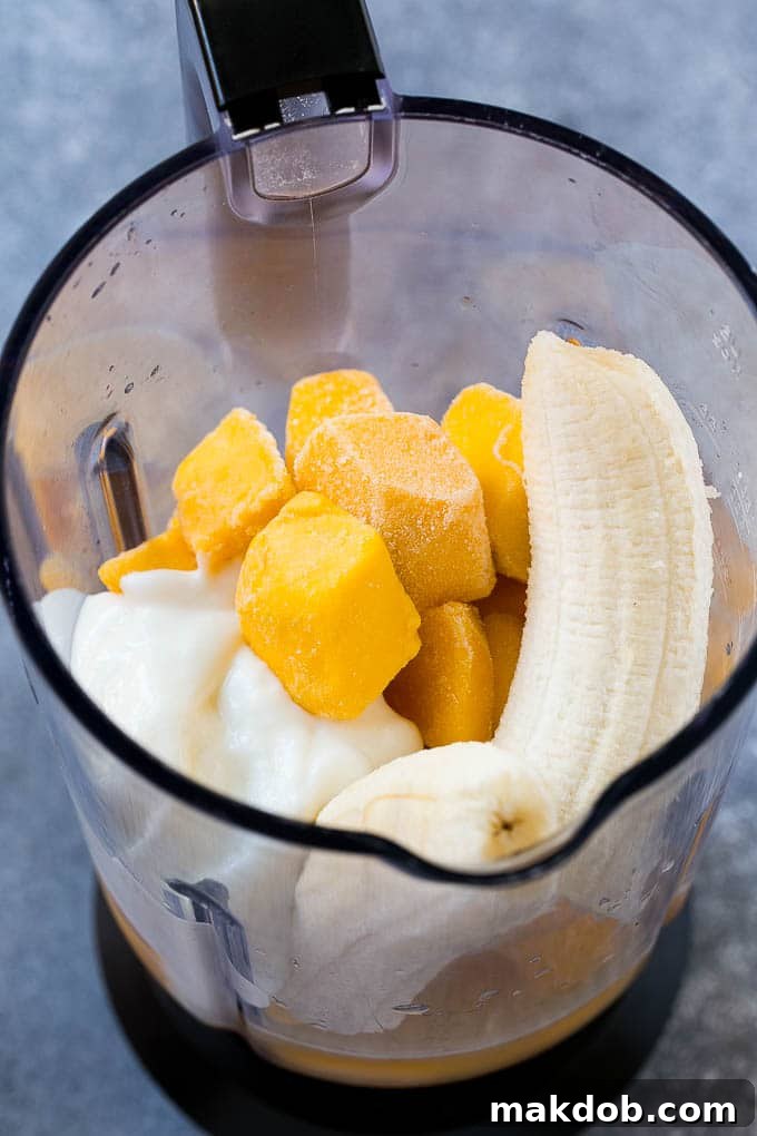 Fruit, yogurt and juice in a blender.
