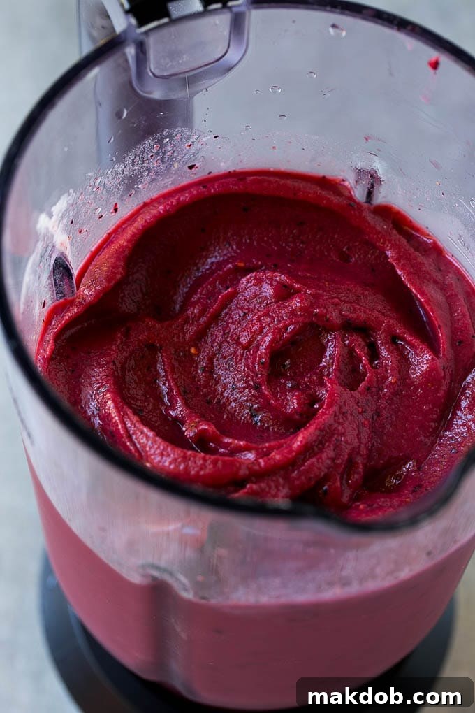 Frozen fruit smoothie in a blender.