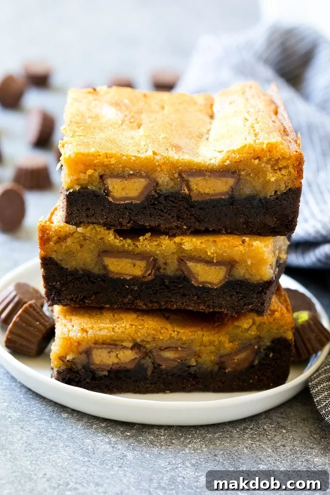 A stack of peanut butter chocolate gooey butter cake slices.