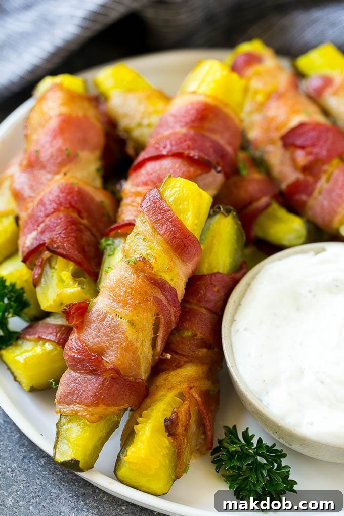 Bacon wrapped pickle fries garnished with parsley.
