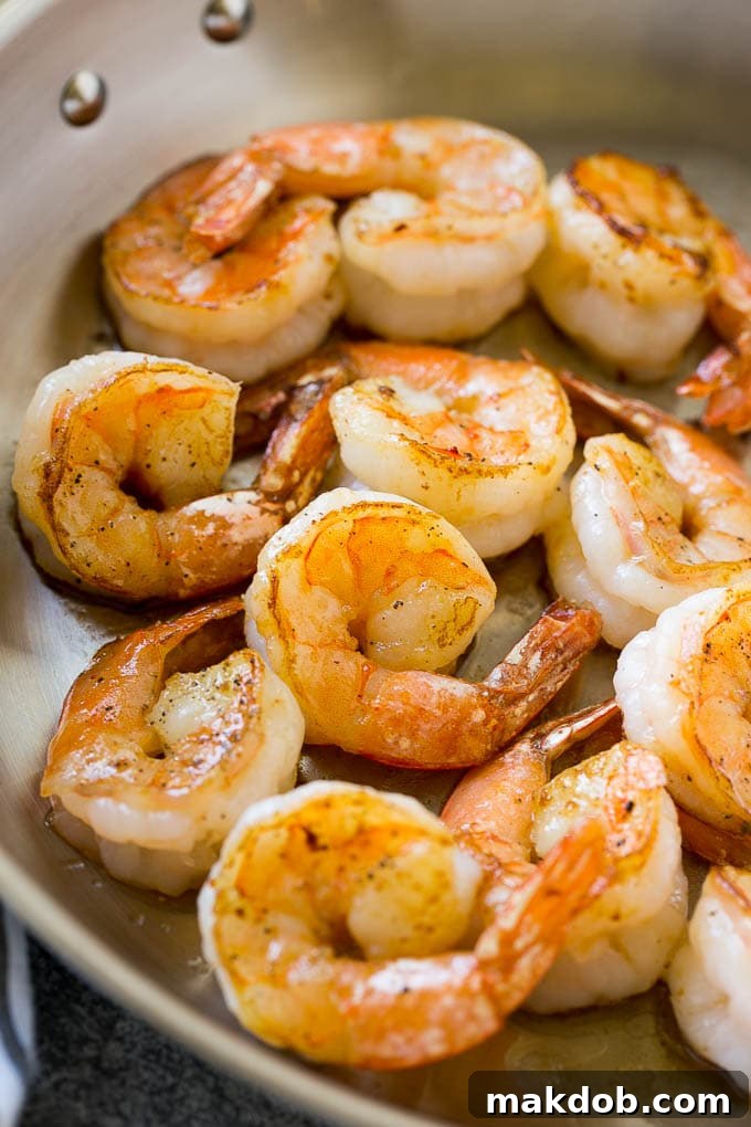 Shrimp Alfredo Recipe | Shrimp Alfredo Pasta | Shrimp Fettuccine Alfredo #shrimp #pasta #italianfood #dinneratthezoo Seared shrimp in butter, in a skillet.