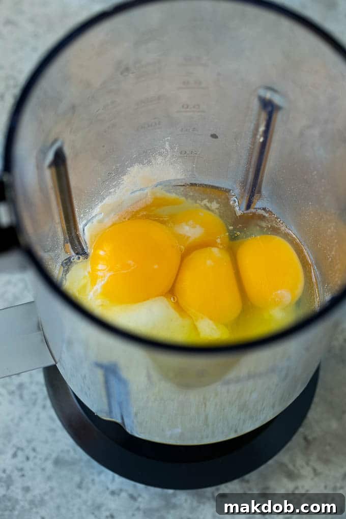 Eggs, milk, sugar and flour in a blender.