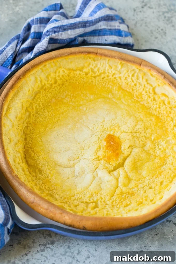 A puffed pancake in a skillet.