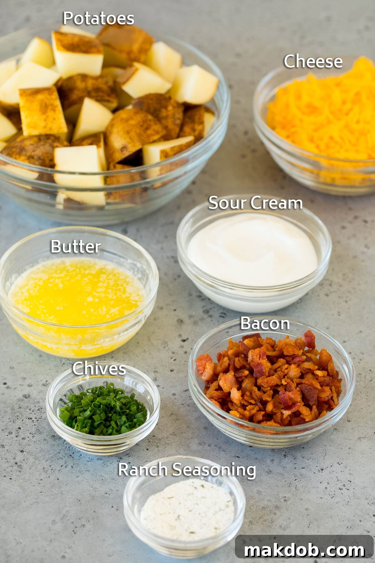 Grill-Wrapped Potatoes 3 Bowls of ingredients including potatoes, butter, ranch seasoning, cheese and bacon.