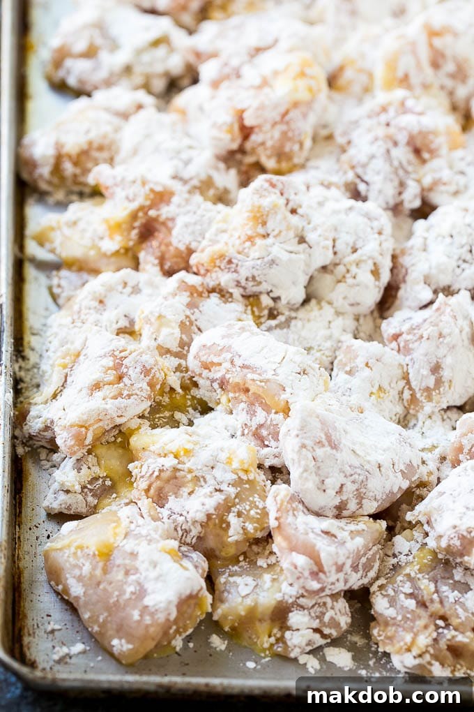 Chicken pieces coated in egg and flour.