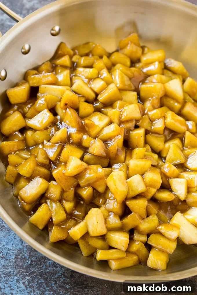 Fried Apple Pies Recipe | McDonald's Copycat Recipe | Apple Pie | Apple Hand Pies #pie #apples #applepie #dessert #snack #dinneratthezoo Homemade apple pie filling in a skillet.