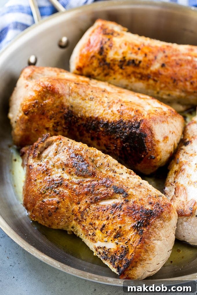 Slow Cooker Pork Tenderloin Recipe | Crock Pot Pork Tenderloin | Easy Pork Tenderloin #slowcooker #crockpot #pork #dinner #dinneratthezoo Seared pork tenderloin in a skillet.