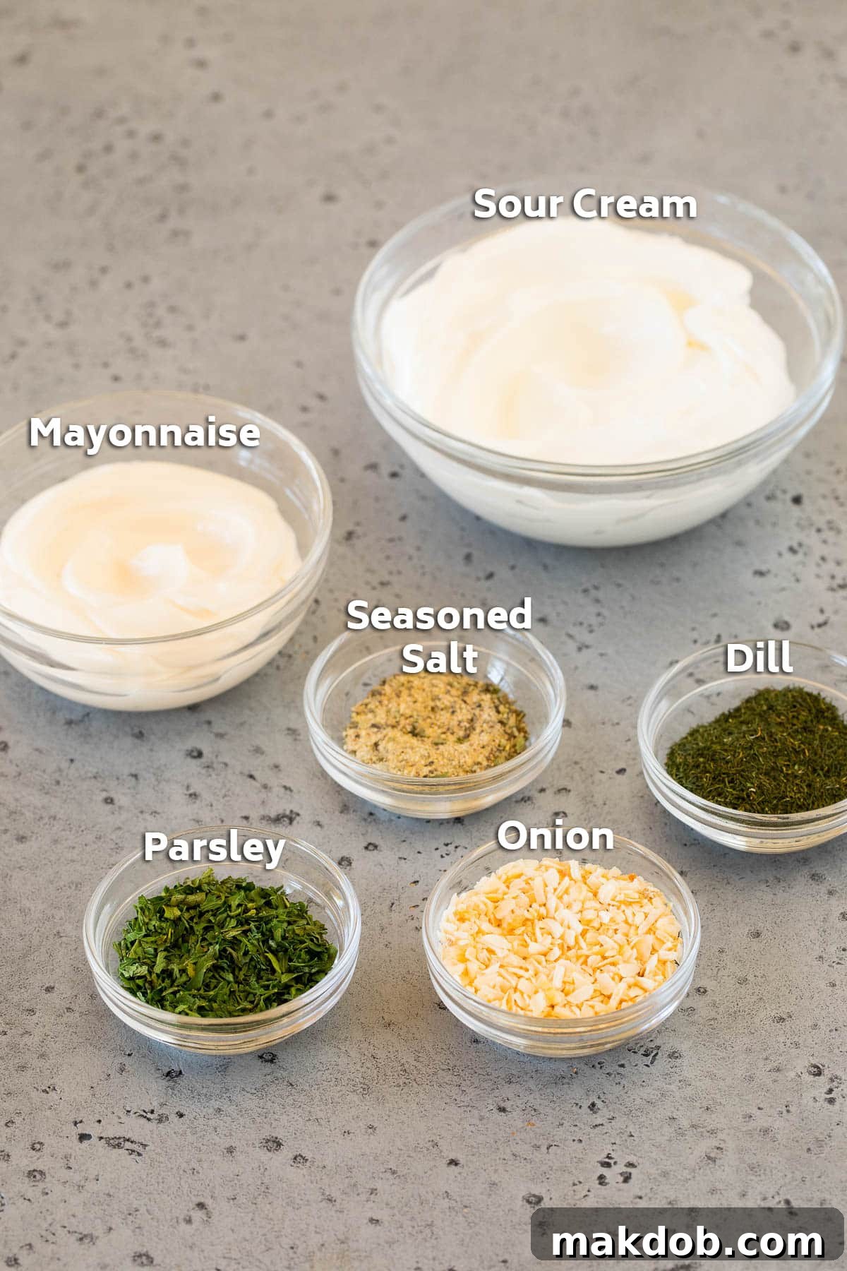 Creamy Dill Delight 3 Bowls of ingredients including sour cream, mayonnaise and dried herbs and spices.