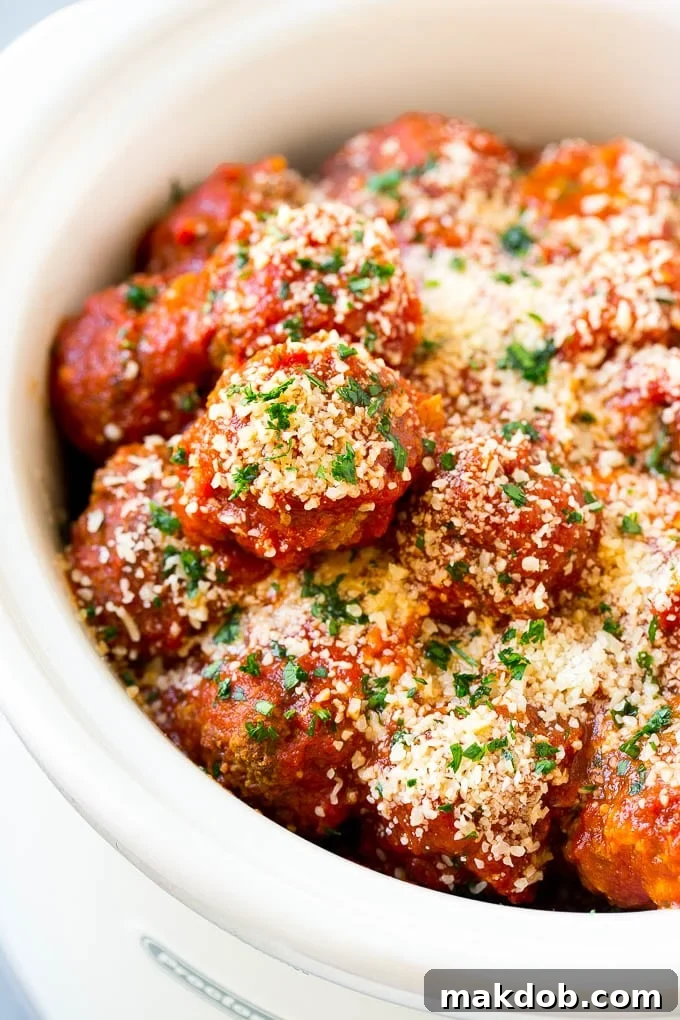 Classic Italian Slow Cooker Meatballs 6 Slow cooker meatballs with tomato sauce and parmesan cheese.