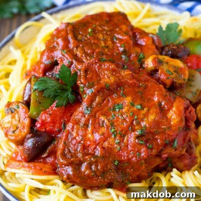 Flavorful Slow Cooker Chicken Cacciatore 4 Slow cooker chicken cacciatore served over pasta.