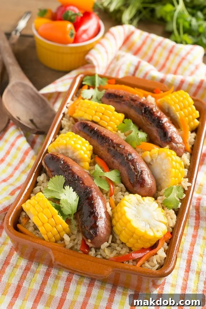 A vibrant One Pot Sausage and Rice Casserole, showcasing smoked sausages, corn, and bell peppers, ready to be served from a single pan.