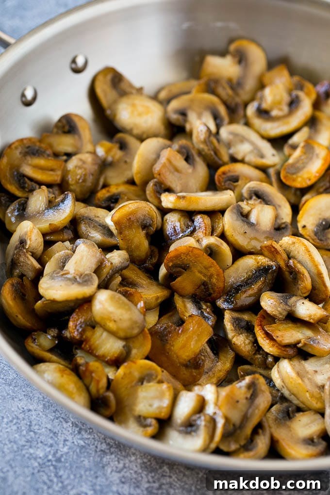 Mushroom Chicken Recipe | Chicken with Mushrooms | Chicken in Mushroom Sauce #chicken #mushrooms #bacon #dinner #dinneratthezoo Sauteed mushrooms in a skillet.