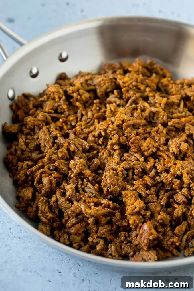 Taco Salad Recipe | Beef Taco Salad | Mexican Salad #salad #taco #beef #lunch #avocado #dinner #dinneratthezoo A pan of taco meat made with ground beef.