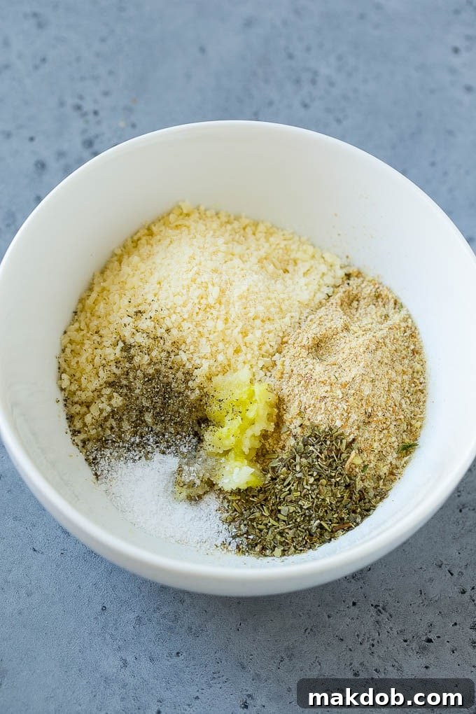 Italian Chicken Recipe | Sheet Pan Chicken | Baked Chicken #chicken #potatoes #dinner #dinneratthezoo A mixture of breadcrumbs, parmesan cheese, garlic and herbs in a bowl.