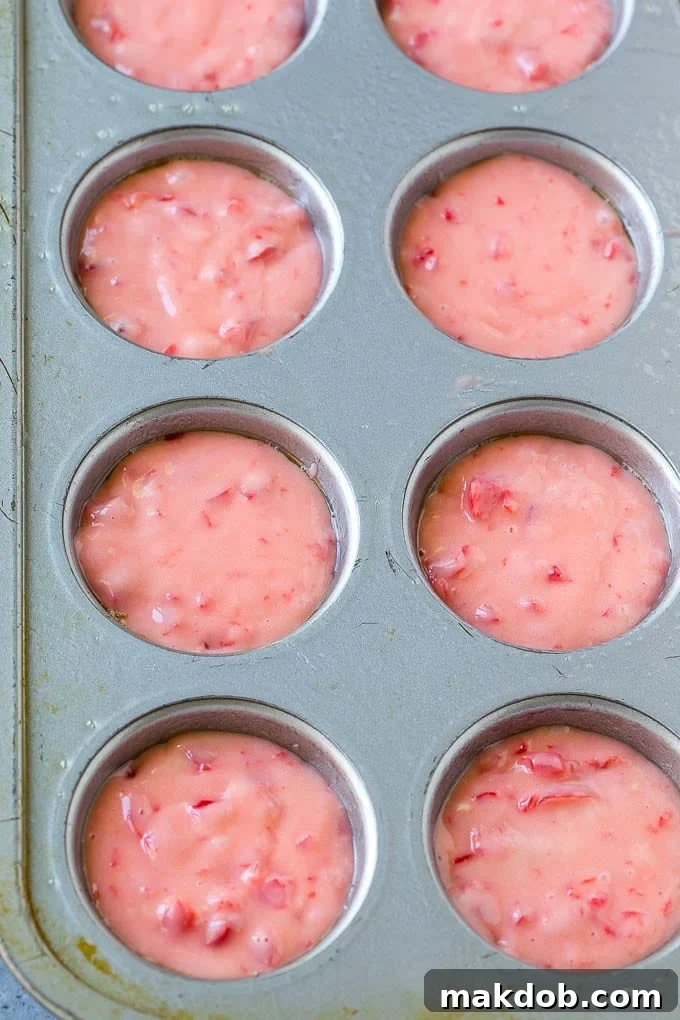 Cherry Muffins Recipe | Maraschino Cherry Muffins #cherries #cherry #muffins #baking #dessert #sweets #dinneratthezoo Cherry muffin batter carefully spooned inside muffin tins, ready for baking.