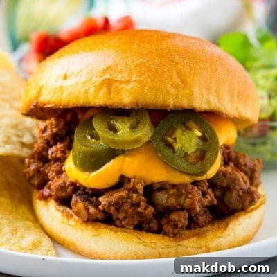Loaded Nacho Sloppy Joes 2 Nacho sloppy joes with ground beef, cheese sauce and jalapenos.