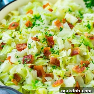 Fried cabbage with bacon, onions and parsley.