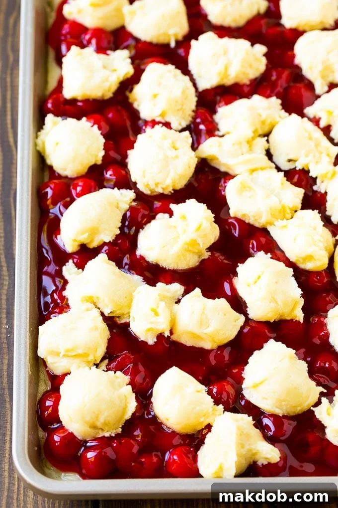 Cherry Bars Recipe | Cherry Pie Bars | Cherry Cookies | Bar Cookies #cookies #bars #cherry #baking #dessert #sweets #dinneratthezoo Filling with dollops of cookie dough on top.