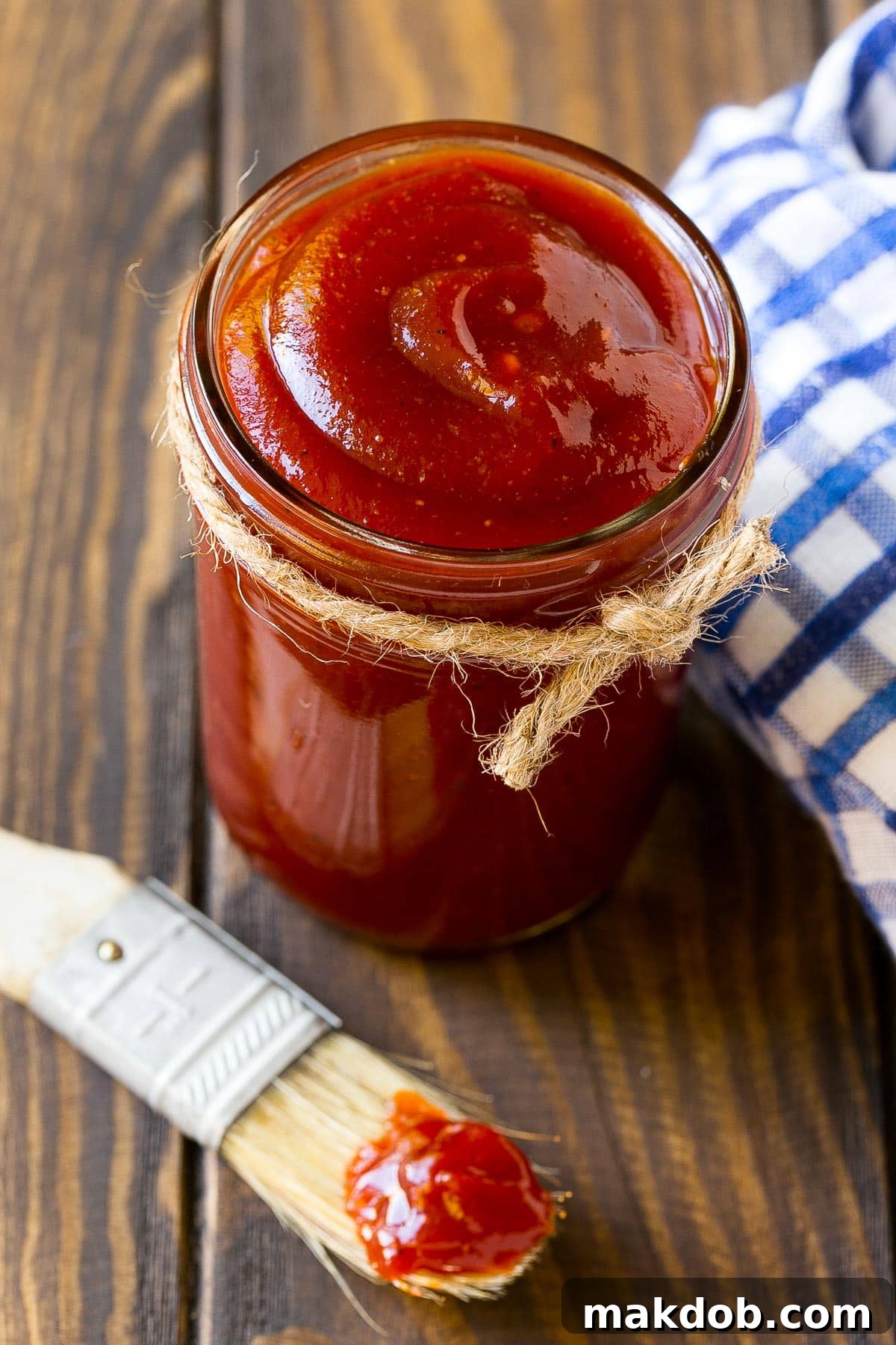 Signature Backyard BBQ Sauce 6 An inviting overhead view of a jar of freshly made BBQ sauce, highlighting its rich color and smooth texture.