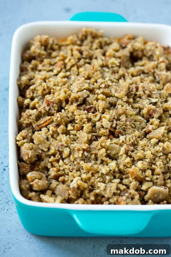 Ruth's Chris Sweet Potato Casserole Recipe | Sweet Potato Casserole | Mashed Sweet Potatoes #sweetpotatoes #casserole #thanksgiving #christmas #holidays #dinner #dinneratthezoo #sidedish Mashed sweet potatoes topped with a brown sugar and pecan streusel.
