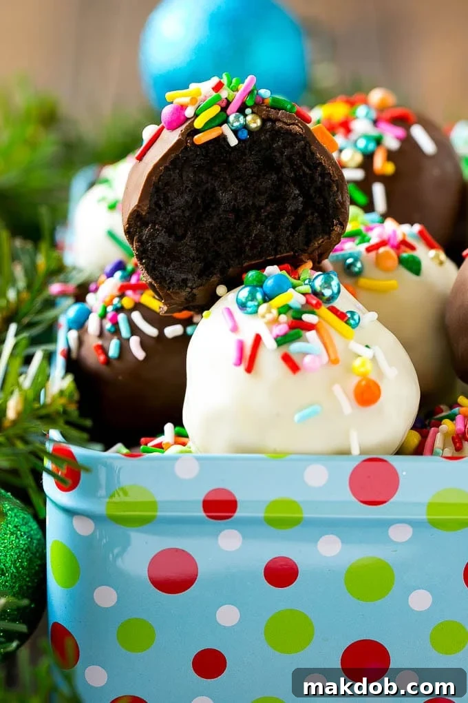 A cross section of an Oreo ball inside a holiday gift tin.