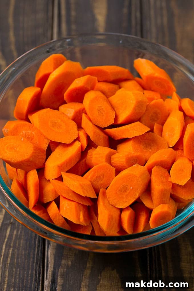 A bowl of peeled and sliced carrots.