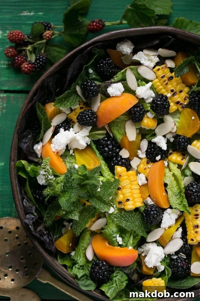 Blackberry salad with apricots, corn, feta cheese and almonds, perfectly dressed with a creamy sauce.