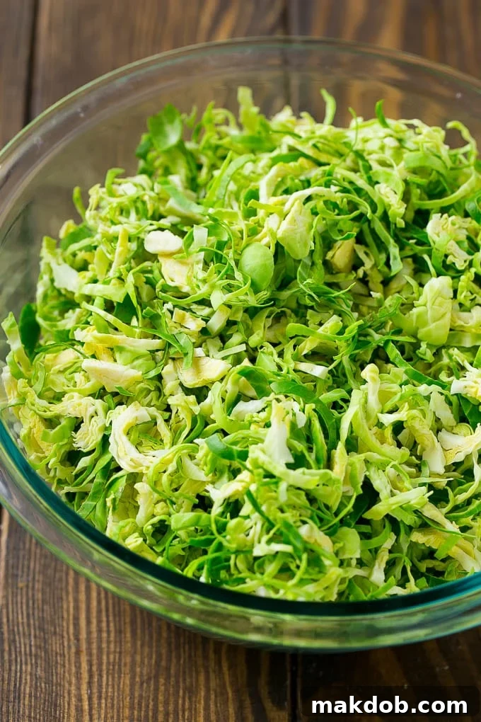 Shredded sprouts in a glass bowl.