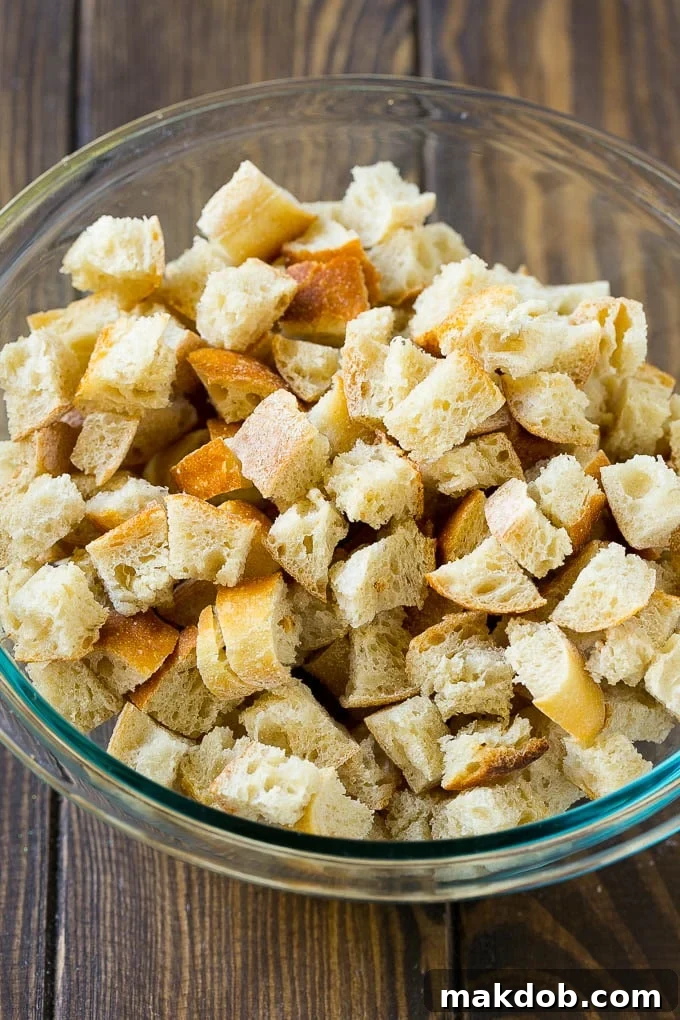 Dried bread cubes in a mixing bowl, essential for good stuffing texture.