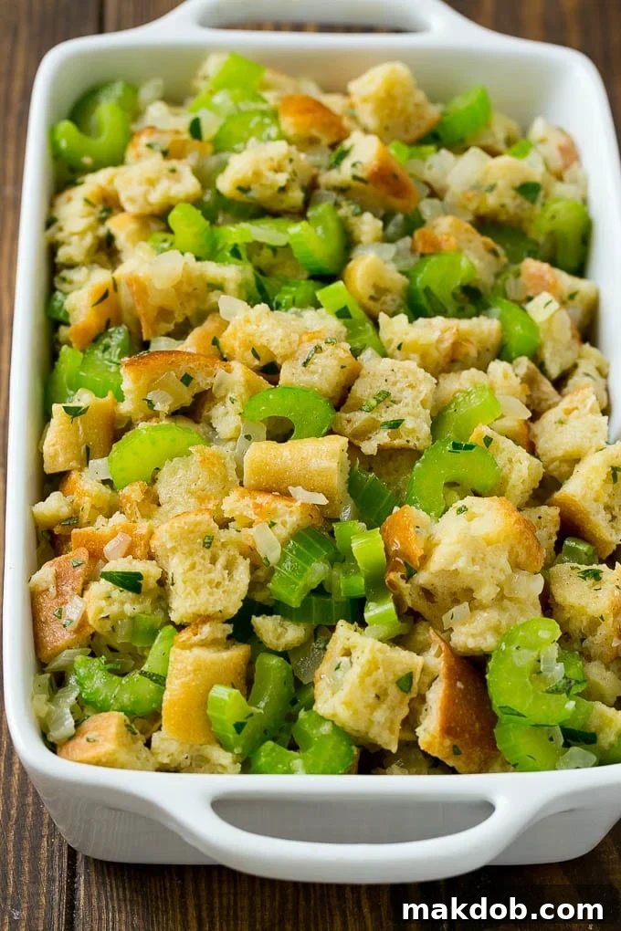 Uncooked holiday stuffing in a baking dish, ready for the oven.
