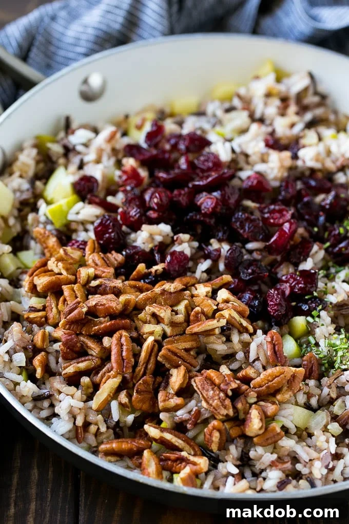 Apples and wild rice topped with dried cranberries, pecans and herbs.