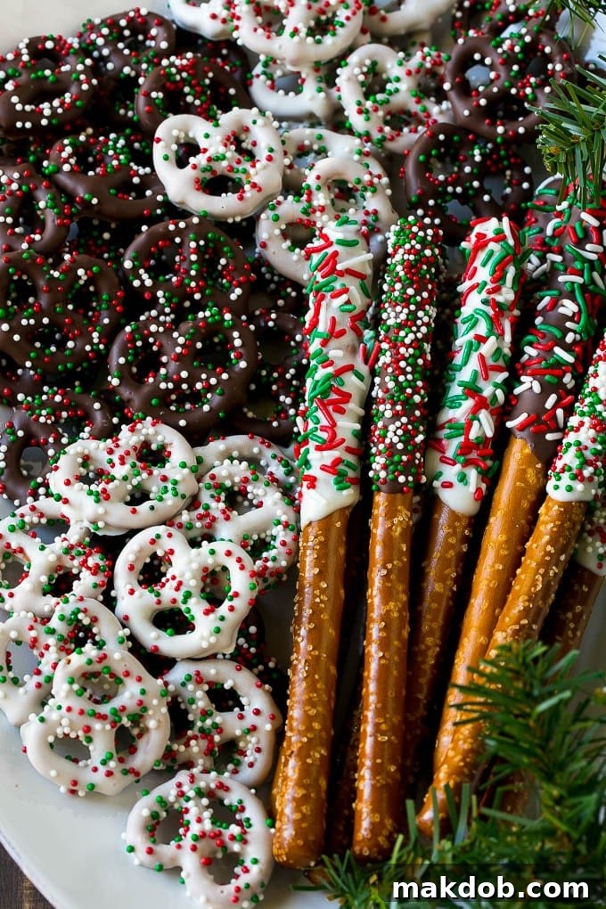 Chocolate Covered Pretzels Recipe | Sprinkle Pretzels | No Bake Dessert #pretzels #chocolate #christmas #sprinkles #candy #dinneratthezoo Chocolate covered pretzel twists and rods on a serving platter.