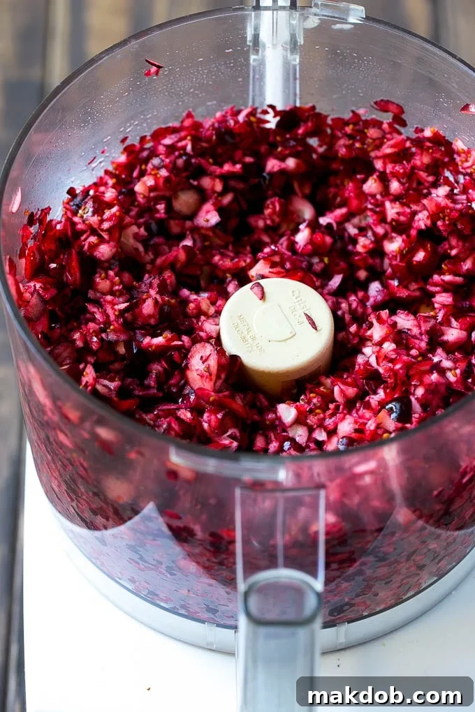 Chopped cranberries in a food processor, perfectly pulsed for relish.