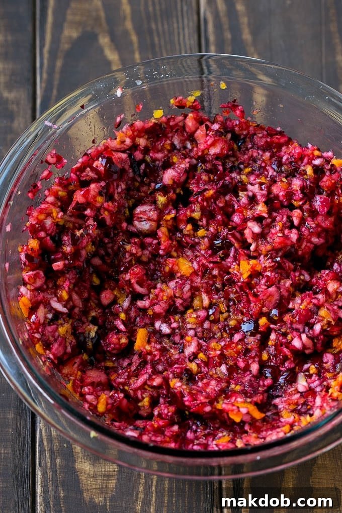 Cranberry relish in a mixing bowl, showcasing its chunky texture.