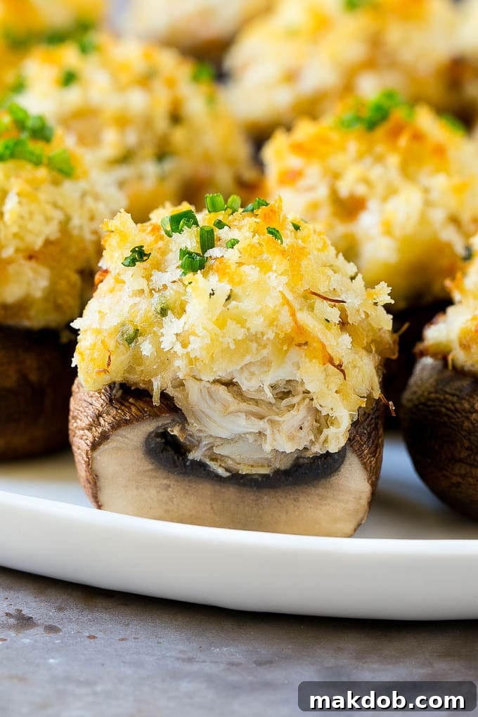 A cross section of a crab stuffed mushroom, revealing the generous filling.